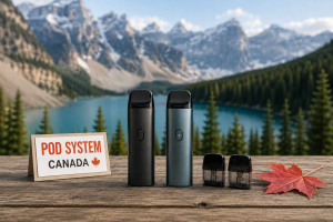 Pod system vape devices with refillable pods on a wooden table overlooking a Canadian mountain lake.