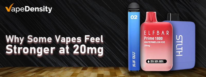 A promotional banner for VapeDensity titled "Why Some Vapes Feel Stronger at 20mg." The image features three different vaping devices—a blue slim pen, a red ELFBAR Prime, and a purple STLTH—displayed on a wooden surface against a dark, textured backdrop.